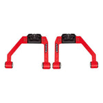 Red UMI Performance adjustable upper A-arm kit for 2015-2026 Ford F-150 featuring CNC-machined steel and Delrin bushings.
