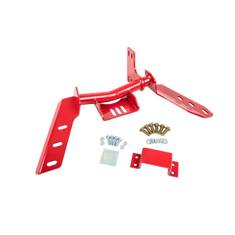 Red powder-coated UMI Performance torque arm relocation crossmember for 1982-1992 GM F-Body with 4L60E transmission.