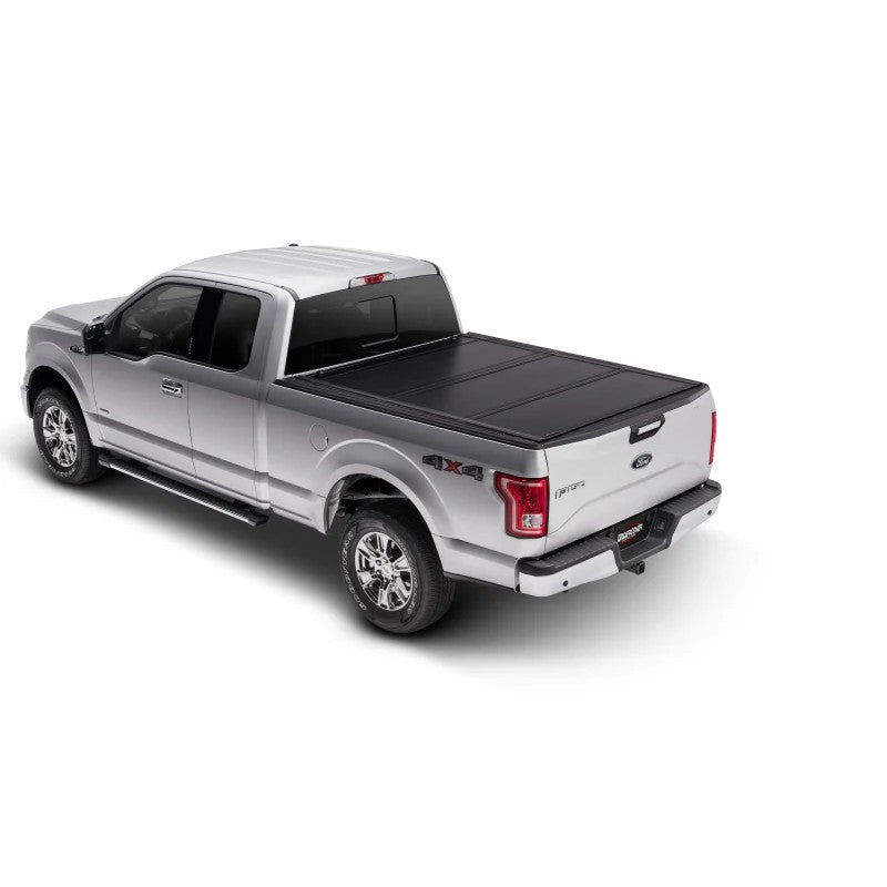 UnderCover Ultra Flex matte black hard-folding tonneau cover on a 2015-2020 Ford F-150 with a 5.5-foot bed