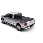 Matte black UnderCover Ultra Flex hard-folding truck bed cover for 2017-2026 Ford Super Duty