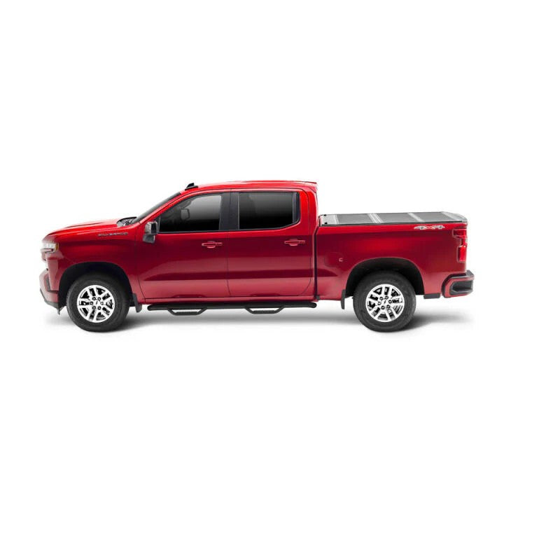 UnderCover Armor Flex black textured hard folding tonneau cover on a Chevrolet Silverado with a 5.8ft bed.