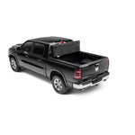 Matte black UnderCover Ultra Flex hard-folding tonneau cover installed on a Ram 1500 truck bed