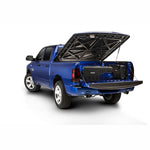 UnderCover SwingCase driver side truck bed storage box in smooth black for 2019-2026 Ram 1500.