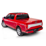 Silver Metallic UnderCover Elite LX painted tonneau cover installed on a Ram 1500 5.7ft truck bed