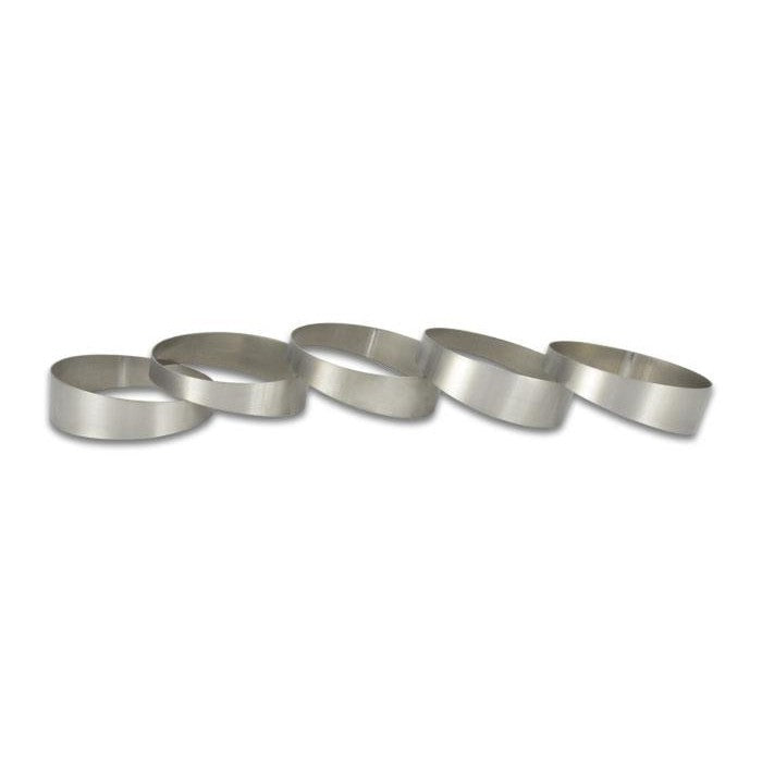 Set of five 3-inch O.D. CP1 Grade Titanium pie cuts for custom automotive fabrication.