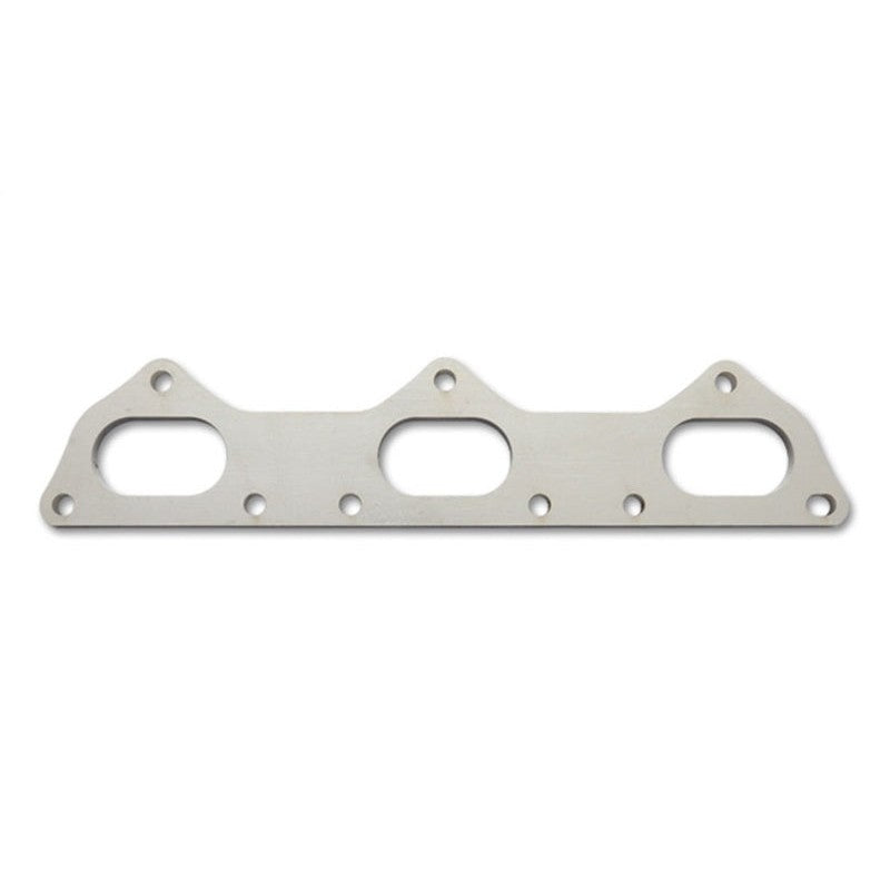 A pair of laser-cut 3/8 inch thick exhaust manifold flanges for Porsche 911 996 engines by Vibrant Performance.