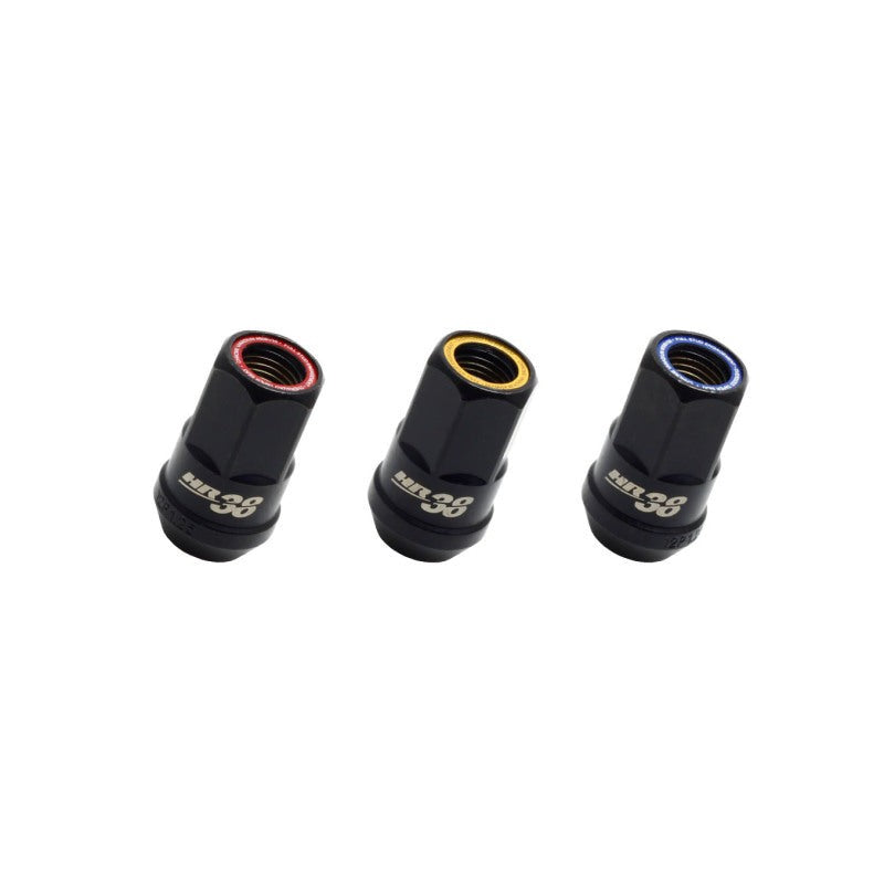 Muteki HR38 open-end performance lug nuts in black chrome with a yellow ring and 12x1.25 thread pitch.