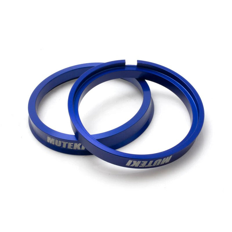 Two blue anodized aluminum hub centric rings, 73mm outer diameter and 64mm inner diameter.