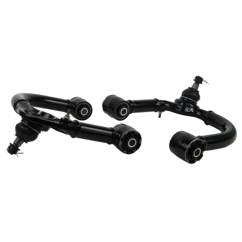 Whiteline KTA249 front upper control arms featuring black powder coating and maintenance-free GIIRO bushings.