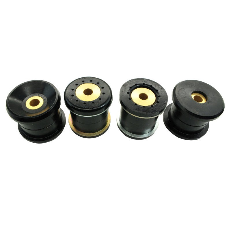 Whiteline KDT917 synthetic elastomer rear crossmember bushings with protective plating and installation grease.