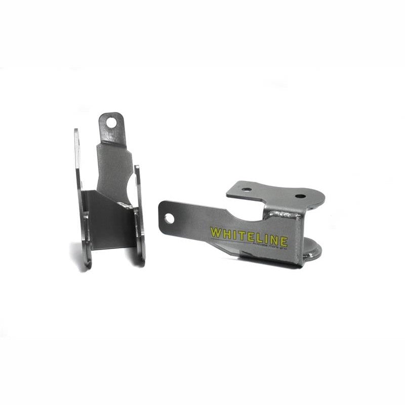 Whiteline KBR37 rear lower control arm relocation brackets with protective plating for 2005-2014 Ford Mustang.