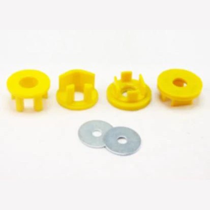 Whiteline KDT903 yellow synthetic elastomer rear differential mount insert bushings and included lubrication grease.