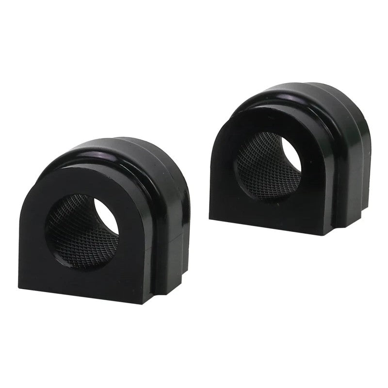 Pair of black Whiteline synthetic elastomer 23.2mm sway bar mount bushings with knurled internal bore.