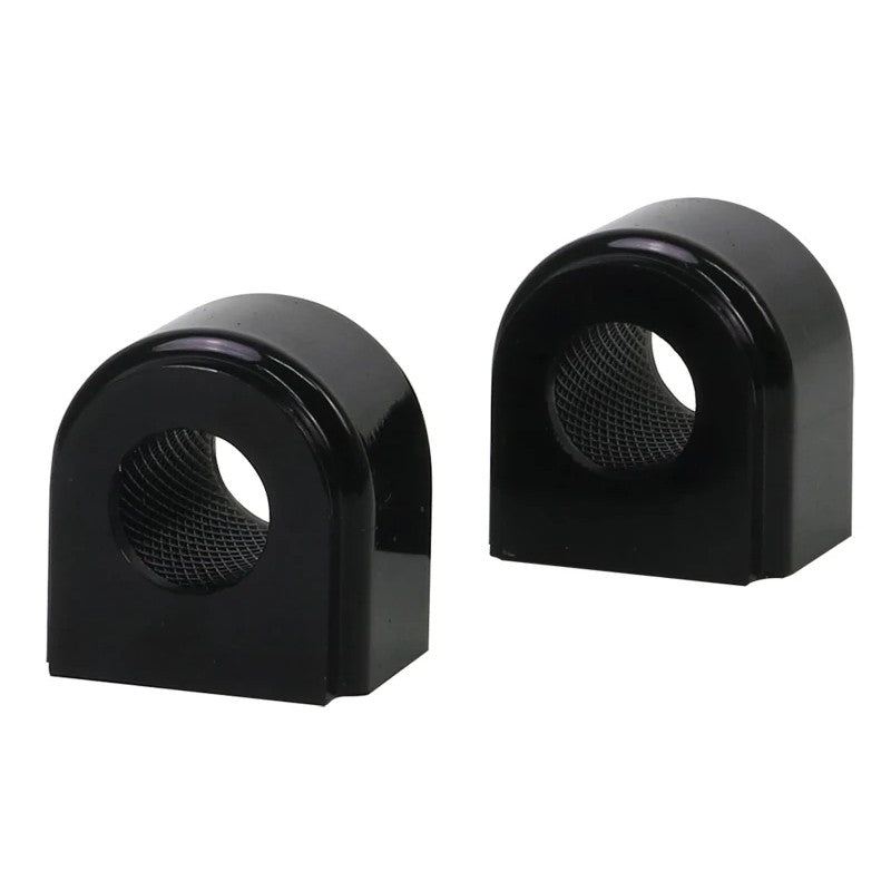 Two Whiteline synthetic elastomer rear sway bar bushings for 20.7mm bars with knurled internal diameters for grease retention.