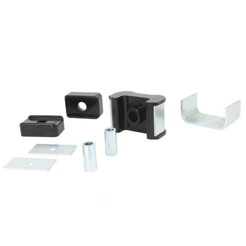 Whiteline W93470 transmission mount bushing kit featuring four bushings, metal sleeves, and mounting plates.