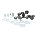 Whiteline W93498 body mount bushing kit with 12 black bushings, steel inner tubes, washers, and assembly grease.