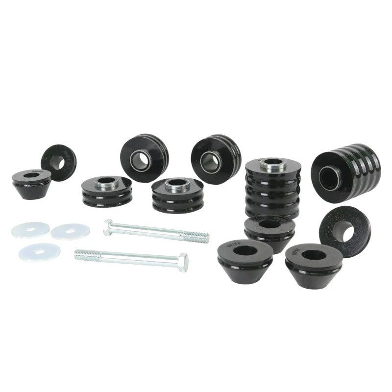 Whiteline W93491 body mount bushing kit with black elastomer bushings and plated metal hardware.