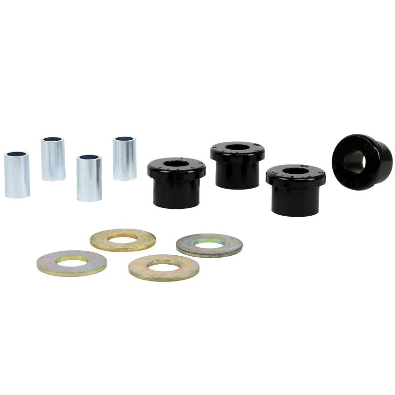 Whiteline W13401 steering rack bushing kit featuring black synthetic elastomer bushings and plated metal sleeves.