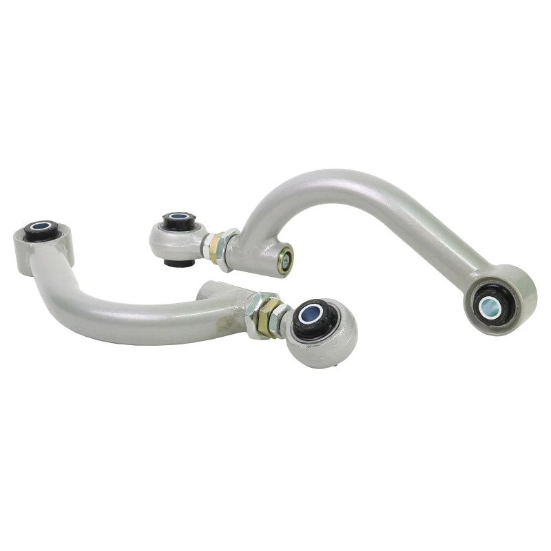 Pair of Whiteline heavy-duty black powder-coated adjustable rear control arms with silver turnbuckle adjusters.