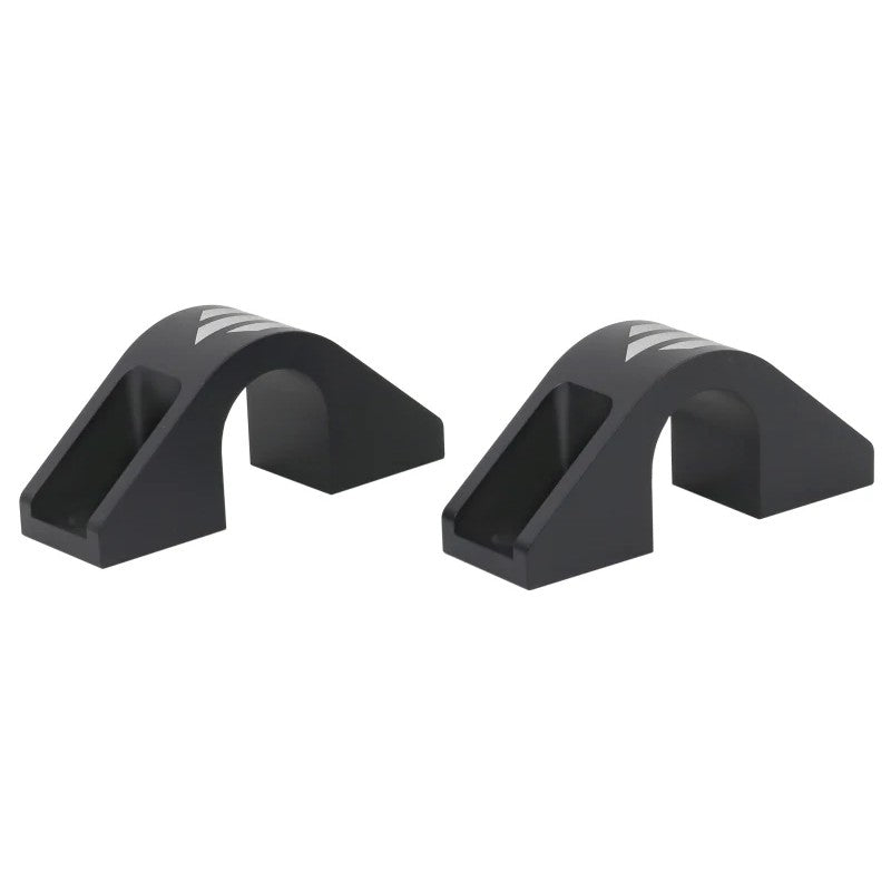 Whiteline KBR10 anodized alloy sway bar mount saddle showing 65mm center-to-center mounting holes.