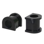 Two black Whiteline synthetic elastomer 24mm sway bar mount bushings showing the knurled internal diameter.