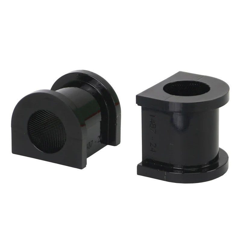 Two black Whiteline synthetic elastomer 24mm sway bar mount bushings showing the knurled internal diameter.