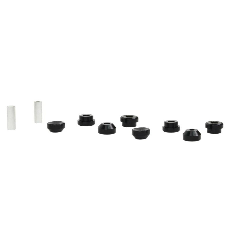 Whiteline Plus front control arm lower inner bushing kit featuring synthetic elastomer bushings and metal sleeves.