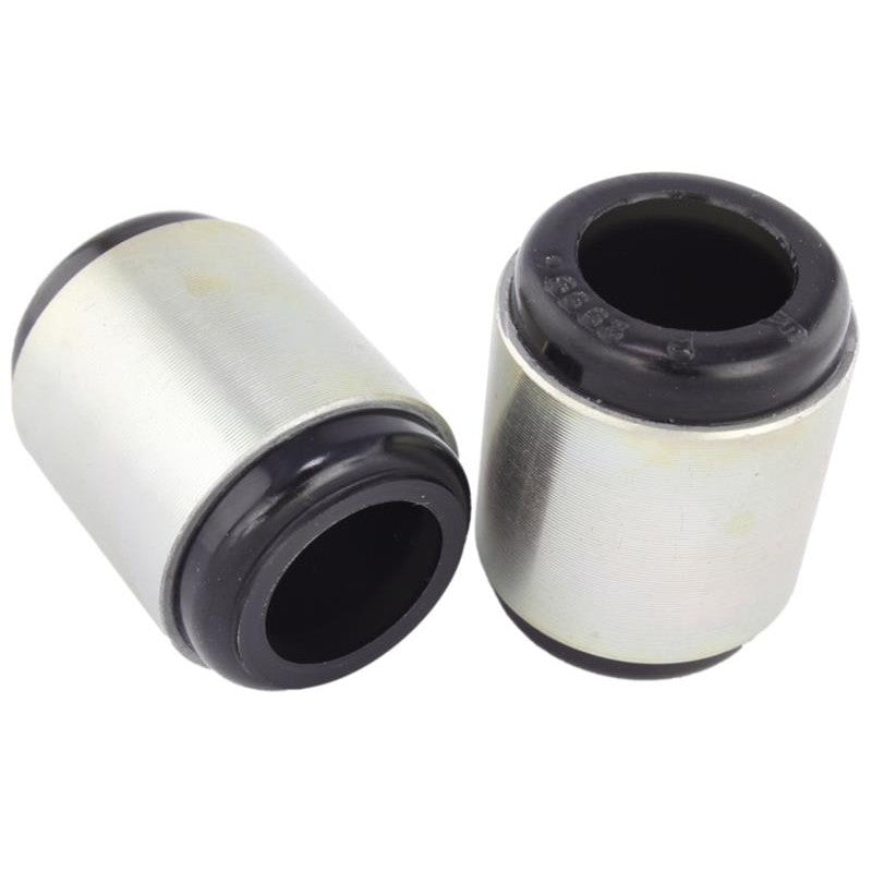 Whiteline W62999 synthetic elastomer rear lower trailing arm bushings with internal grease reservoirs and grease packet.