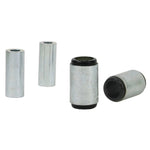 Whiteline Plus yellow synthetic elastomer lower rear control arm bushings with metal sleeves and grease packet.