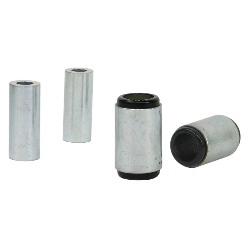 Whiteline Plus yellow synthetic elastomer lower rear control arm bushings with metal sleeves and grease packet.