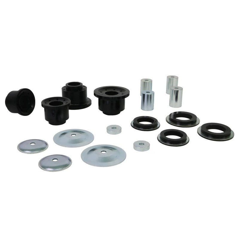 Four yellow Whiteline Plus synthetic elastomer rear subframe mount inserts with included molybdenum grease packet.