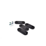 Whiteline W92829 synthetic elastomer front gearbox crossmember pad bushing with protective metal plating.