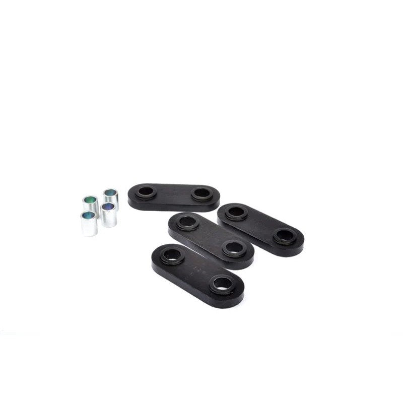 Whiteline W92829 synthetic elastomer front gearbox crossmember pad bushing with protective metal plating.