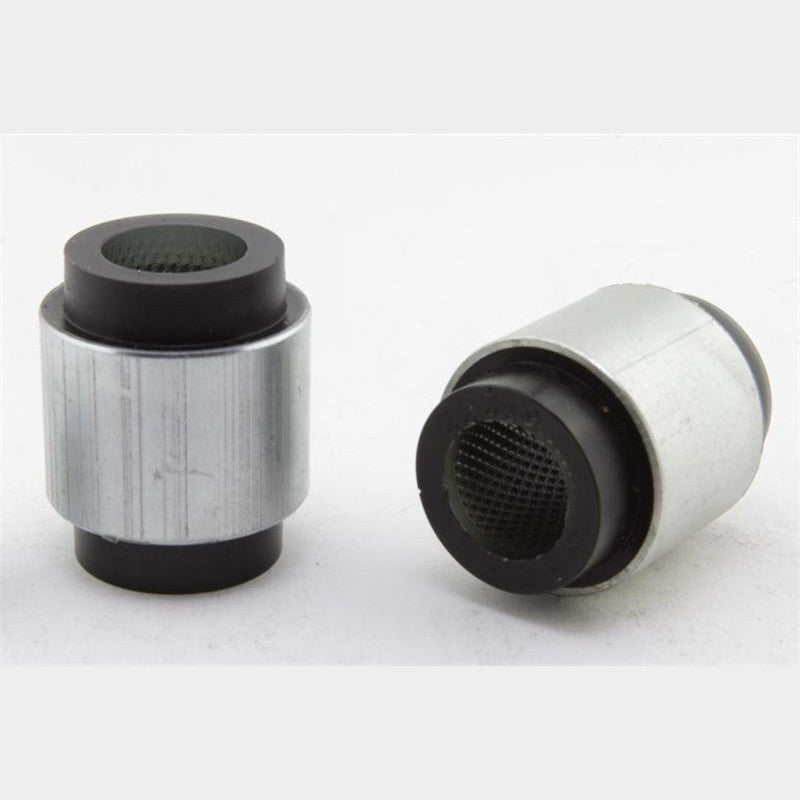 Whiteline Plus synthetic elastomer rear lower inner control arm bushings with metal sleeves and lubricant.