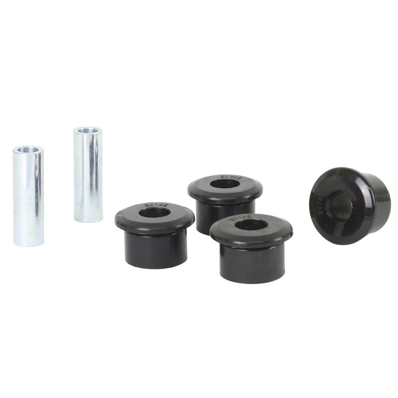 Four Whiteline universal pivot bushings and two metal tubes for leaf spring suspension systems.