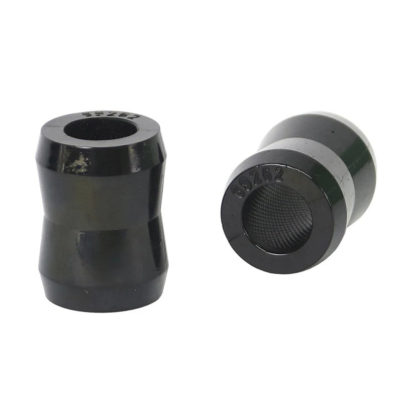 Pair of Whiteline black synthetic elastomer universal shock eye bushings with a packet of assembly grease