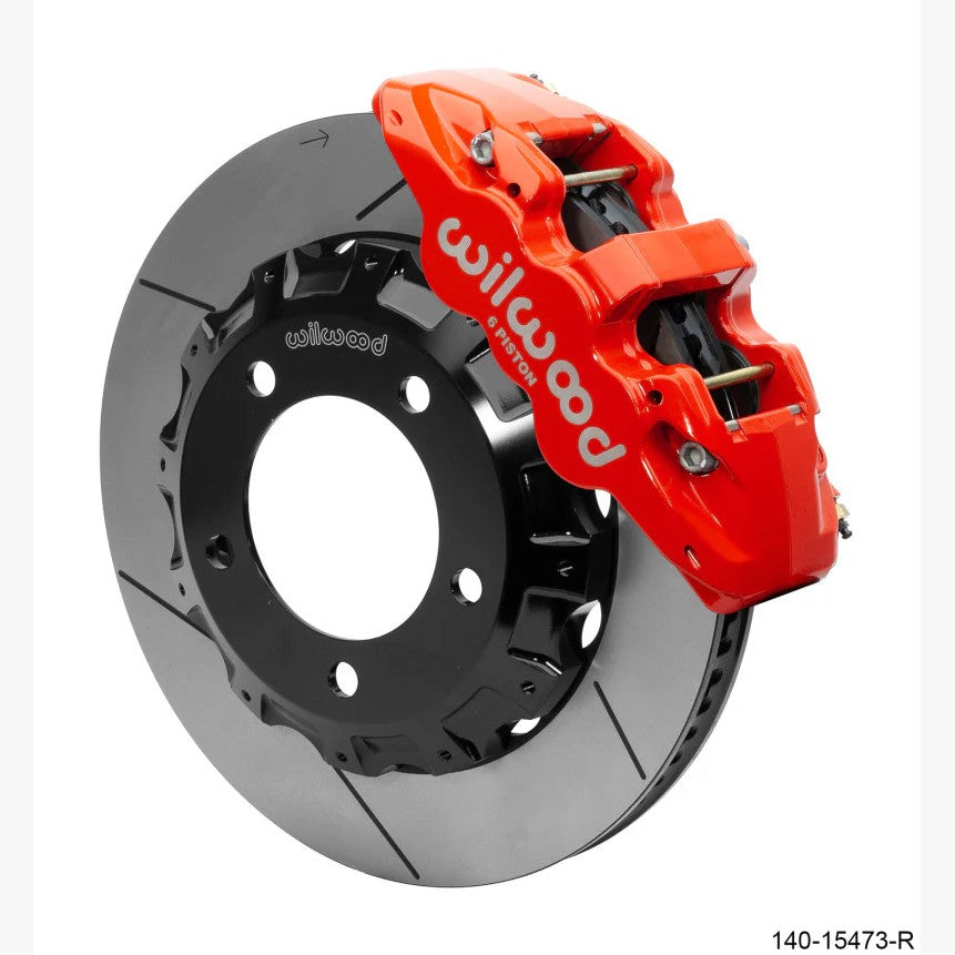 Wilwood AERO6 red six-piston calipers with 14.25-inch rotors and stainless steel brake lines for Toyota Land Cruiser.