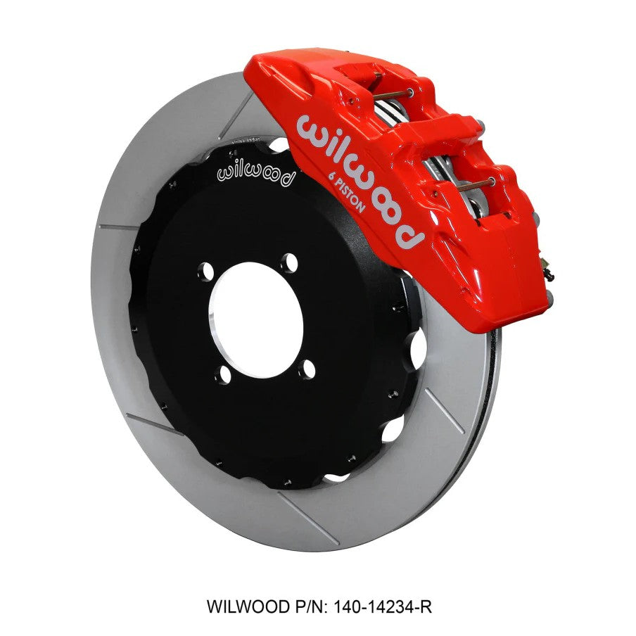 Wilwood Dynapro 6 front brake kit featuring red six-piston calipers, 12.88-inch rotors, and stainless steel lines.