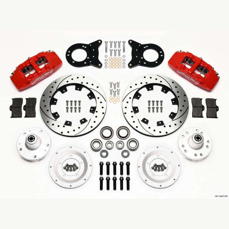 Wilwood DynaPro 6 front brake kit with red 6-piston calipers and 12.19-inch drilled and slotted rotors.