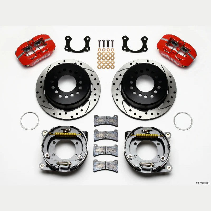 Wilwood Dynapro Low-Profile rear disc brake kit with red 4-piston calipers and 11-inch drilled and slotted rotors.