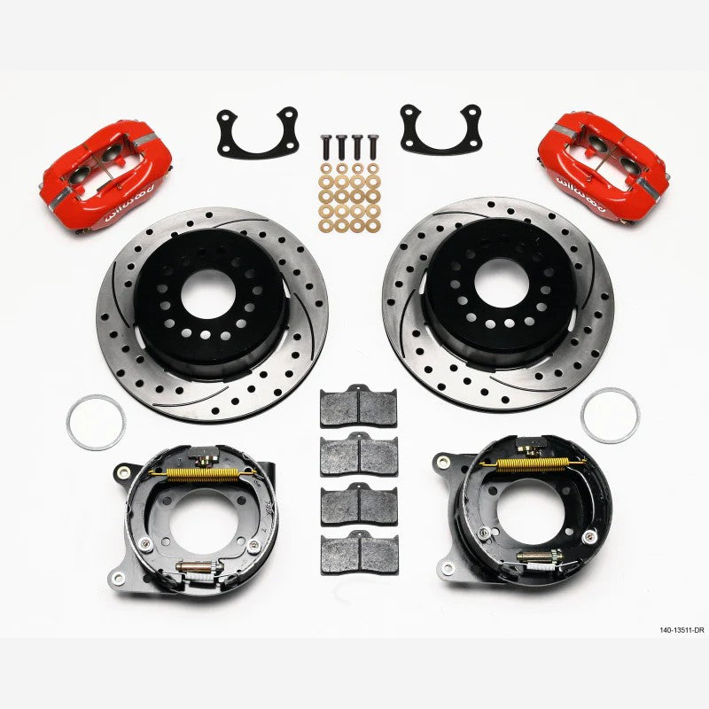 Wilwood Forged Dynalite rear disc brake kit featuring red four-piston calipers and 12.19-inch drilled and slotted rotors.