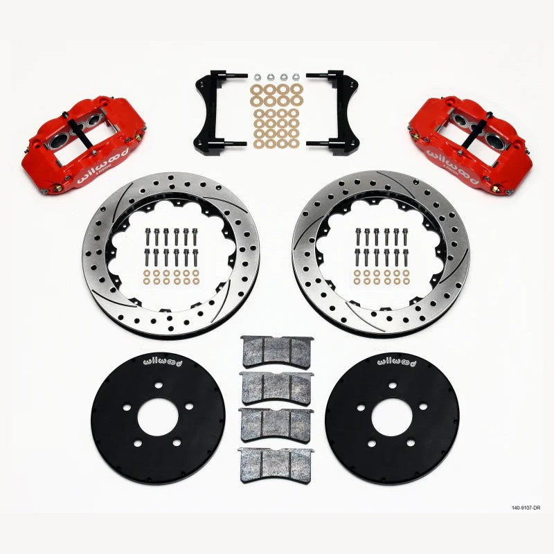 Wilwood Forged Narrow Superlite 6R front brake kit featuring red 6-piston calipers and 12.88-inch drilled rotors.