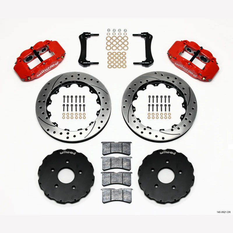 Wilwood red six-piston FNSL6R brake calipers with 13.06-inch drilled rotors and mounting hats.