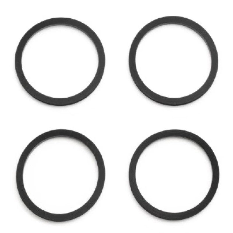 Four black Wilwood 1.12-inch square profile caliper piston seals from the 130-2579 kit.