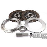 XClutch 9-inch twin solid organic multi-disc clutch service kit including friction discs, pressure plate, and bearings.