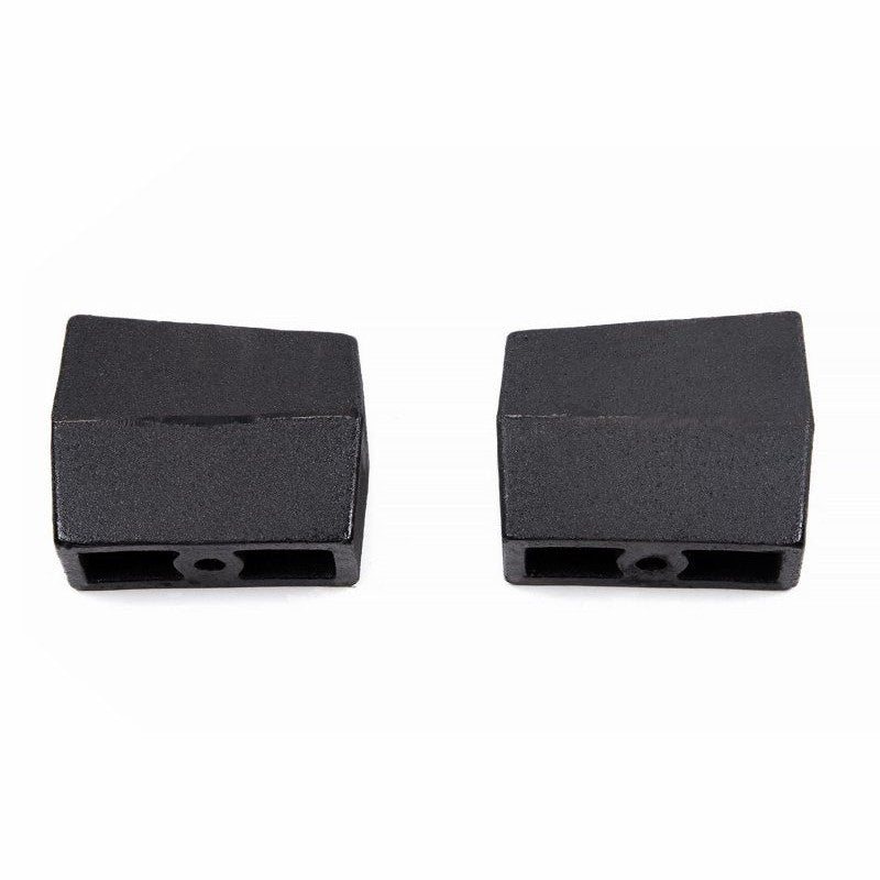 Pair of Zone Offroad 5-inch tapered cast iron rear lift blocks with black e-coat finish and 9/16-inch centering pins.